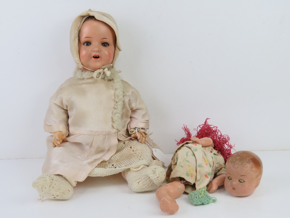 A late 19thC bisque headed jointed doll marked 'AM' Armand Marseille bearing number 996.