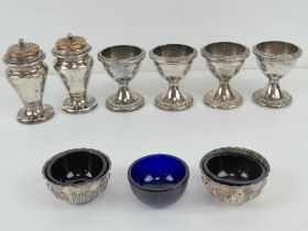 A quantity of silver plated table condiments including a pair of small sugar sifters with gilt