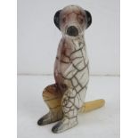 An unusual Raku South African ceramic figurine of a meerkat in crackle glaze standing 13.5cm high.