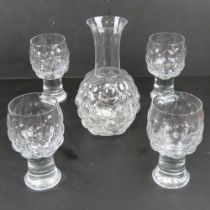A set of four retro glass wine goblets and decanter having grape style bubble pattern throughout.