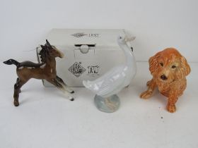 A Beswick figuring of a foal together with a ceramic figurine of a dog marked England and number 18