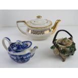 An early 20thC teapot in the form of a shell together with a blue and white Wedgwood bachelor's