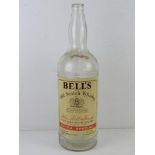 A 4.5 litre Bells Scotch Whiskey bottle, contents deficient, for display purposes.