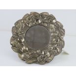 A silver plated foliate themed circular easel mirror, 21cm dia.