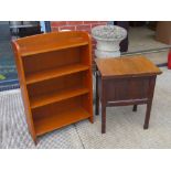 A c1930s oak slid-top work/sewing table opening to reveal compartment within, 52 x 41 x 63cm.