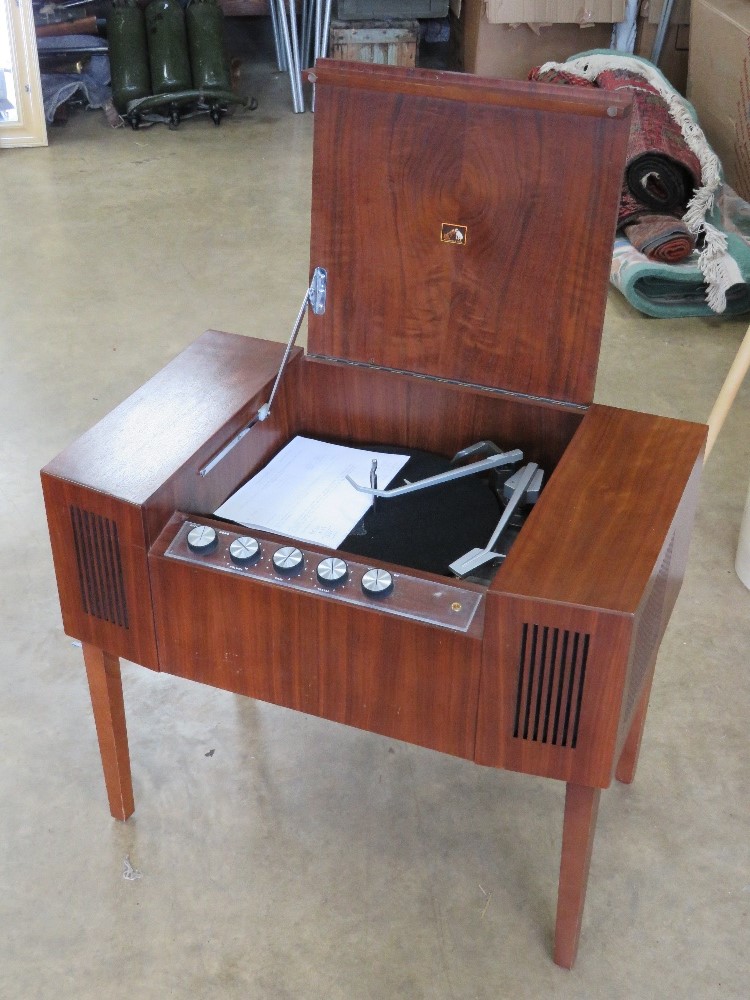 A 1960s HMV Garrard Model 2000 record player in stylised mahogany cabinet measuring 66 x 42 x 55cm,