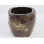 A Martin Brothers stoneware pot decorated with fish in brown ground, 9.5cm high.