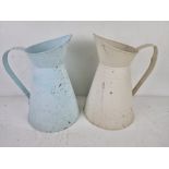 A matched pair of contemporary jugs for floral arranging being cream and pale blue,