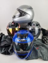 Four Performance Motorcycle helmets.