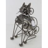 A wine bottle holder in the form of a cat.