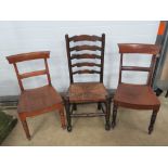 Three assorted dining and kitchen type chairs, one with ladder back and cane seat.