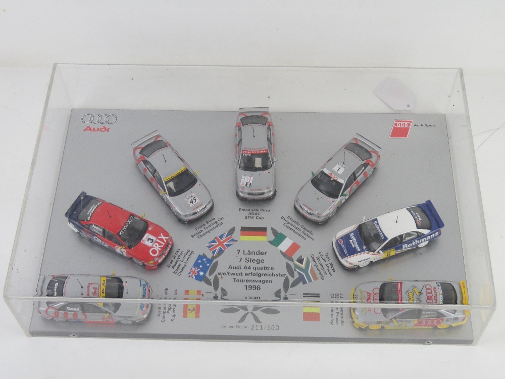 A limited edition display of Audi 1996 Rally race winning model cars by Minichamps in perspex