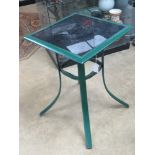 A metal and glass bistro table.
