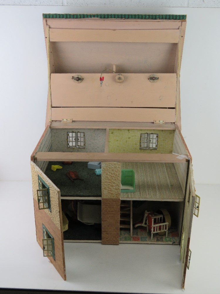 A mid century dolls house having opening windows and door, some furniture within, 50cm wide.