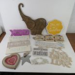 A quantity of assorted contemporary decorative signs and photo frames.