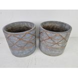 A pair of grey and copper coloured planters 16cm dia.