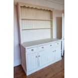 A large cream painted Welsh dresser.
