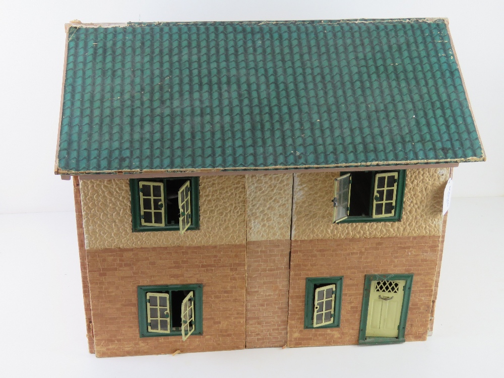 A mid century dolls house having opening windows and door, some furniture within, 50cm wide. - Image 4 of 4