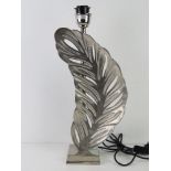 A chromed table lamp in the form of a leaf all standing 53cm high, PAT tested.
