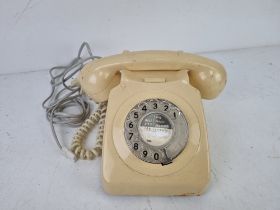 A cream coloured vintage rotary telephone, 8746G.