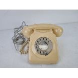 A cream coloured vintage rotary telephone, 8746G.