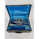 A Melody Maker trumpet in fitted case having silvered mouthpiece.