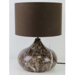 A marbled effect table lamp, with shade, PAT tested, all standing 40cm high, 28.5cm dia.