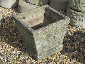 A pre-cast stone garden planter having latticework and hedgehog pattern upon, 35cm wide, 33cm high.