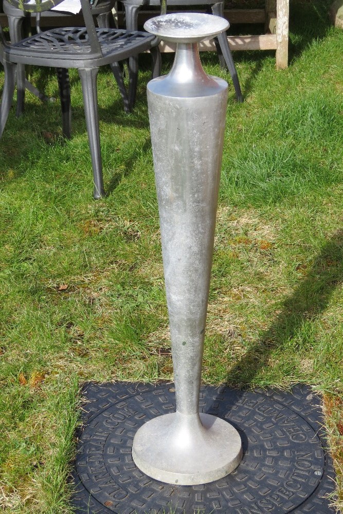 An aluminium vase shaped floor standing candle stand, 86cm high.