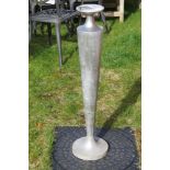 An aluminium vase shaped floor standing candle stand, 86cm high.