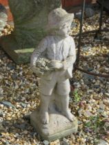 A 'Little Boy Blue' garden statue, 45cm high.