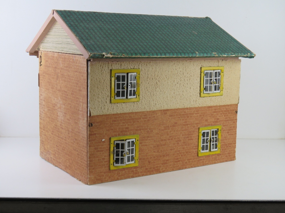 A mid century dolls house having opening windows and door, some furniture within, 50cm wide. - Image 3 of 4