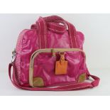 A hot pink 'Key-Per' overnight bag by Fo