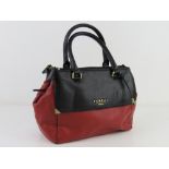 A red and black leather handbag by Fiore