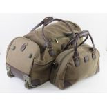 A green and brown wheeled weekend bag wi