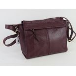 A plum coloured leather handbag by M&S,