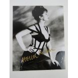 A hand signed photograph of Dame Helen Mirren DBE, autograph in gold pen.