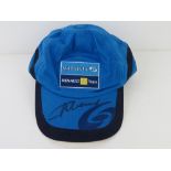 A hand signed F1 baseball cap, signature unknown.