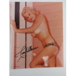 A hand signed glamour photograph of June Wilkinson, autograph in black pen.