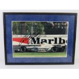 A hand signed photograph of Ralf Schumacher, framed.