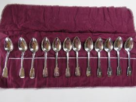 A set of twelve HM silver spoons in roll, hallmarked London 1824 and bearing maker's mark 'JH'.