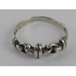 A silver ring having snaffle design, size O, stamped 925.