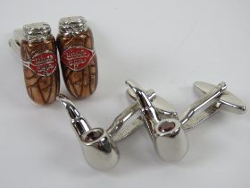 Two pairs of contemporary cuff links, one in the form of Cuban cigars,