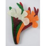 An overlaid plastic brooch in the style of Lea Stein in the form of a floral bouquet,