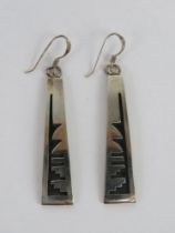 A pair of Native American carved pattern earrings,