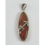A silver and hardstone pendant with arrow design upon, stamped 925, total length 4cm.