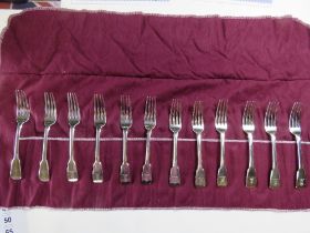 To match above lot; A set of twelve HM silver salad forks in roll,