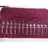 To match above lot; A set of twelve HM silver salad forks in roll,