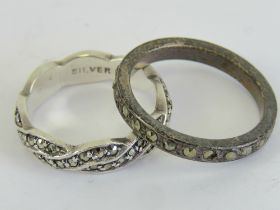 Two silver and marcasite rings, one being Sterling in plaited design size L,