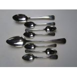 Eight assorted HM silver spoons bearing matching monograms and consisting; one serving spoon,